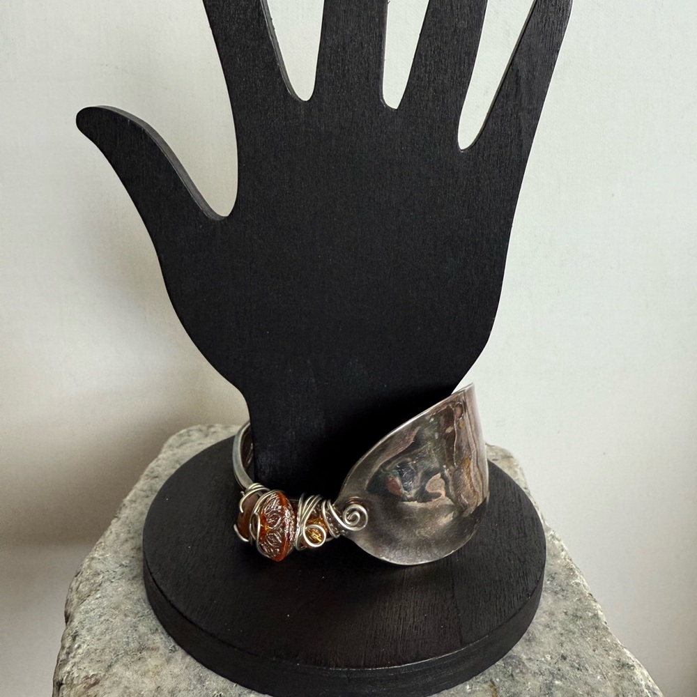 Silver and Brown Asymmetrical Spoon Bracelet with Intricate Detailing
